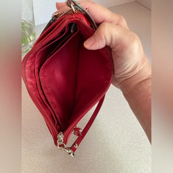 Coach Glossy Embossed Signature Wristlet
Cranberry Patent Leather Red - Picture 8 of 13